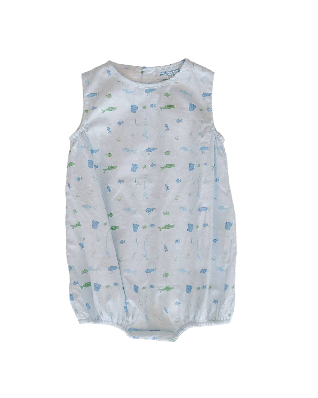 Baby romper with fish pattern on a textured beige surface